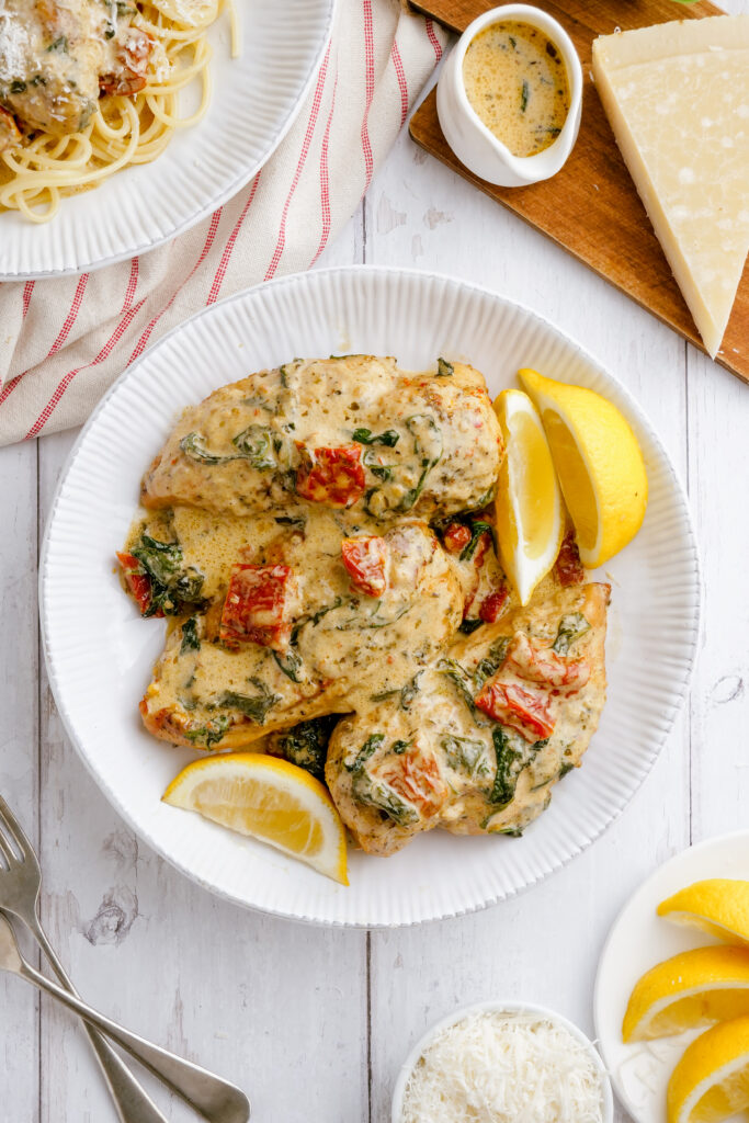 Instant pot tuscan chicken on a white platter