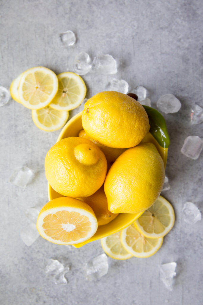 Using lemons to make lemonade, fresh lemons