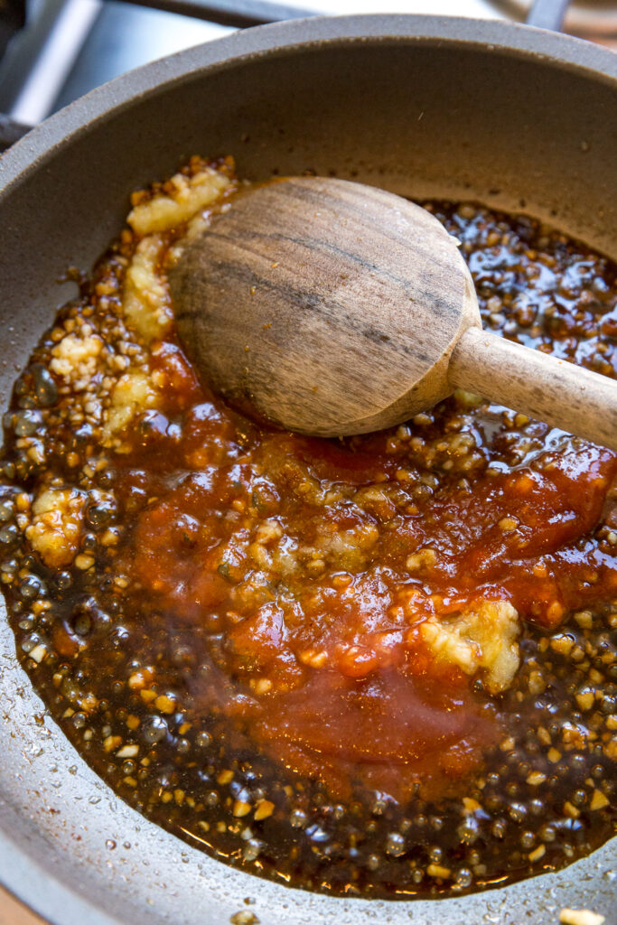 Making the spicy garlic ginger sauce for edamame