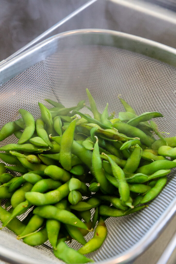 Edamame that has been cooked and then drained.