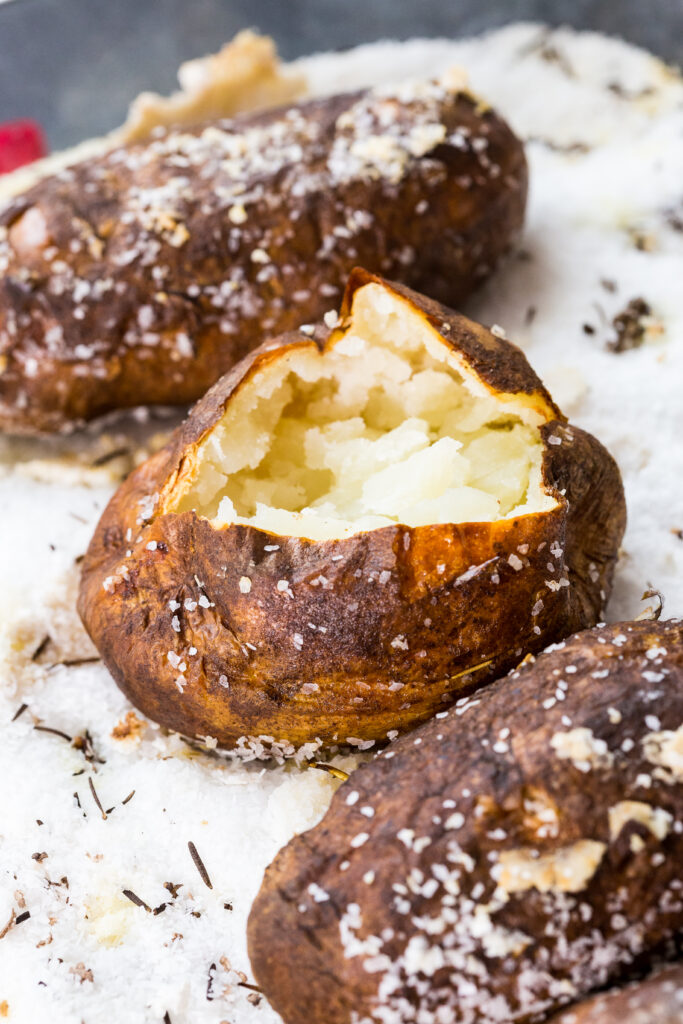 How to make salt baked potatoes, by baking the potatoes in a bed of salt. 