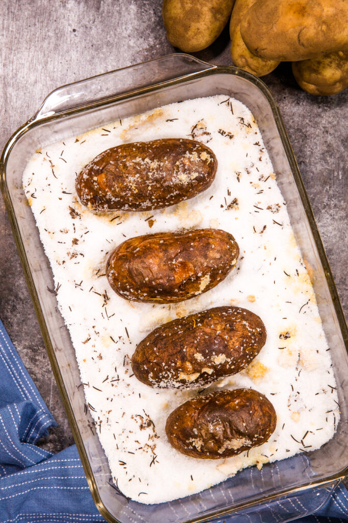 Salt baked potatoes, potatoes being baked on a bed of salt to get fluffy insides and crispy exterior. 