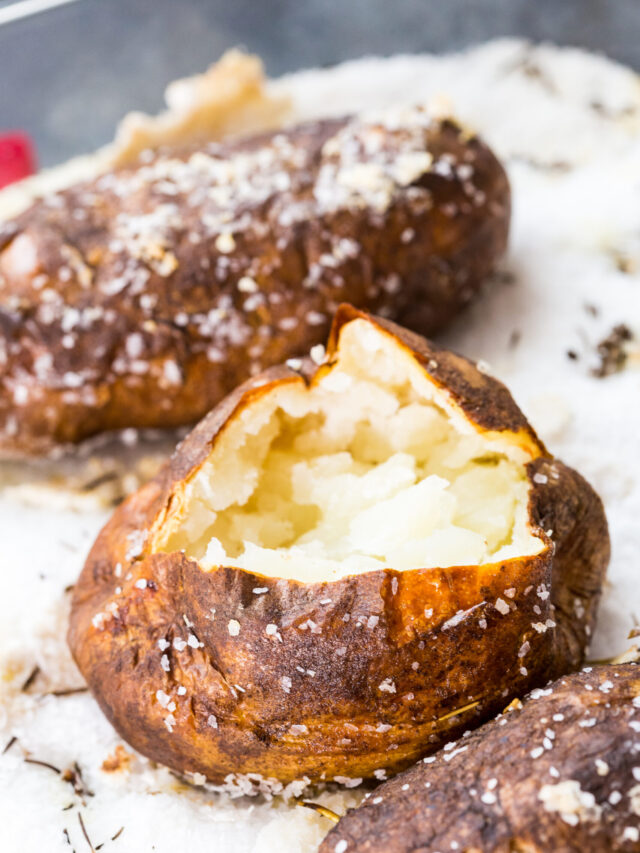 Salt baked potatoes, a deliciously fluffy and light baked potato, cooked in a bed of salt with garlic and rosemary.