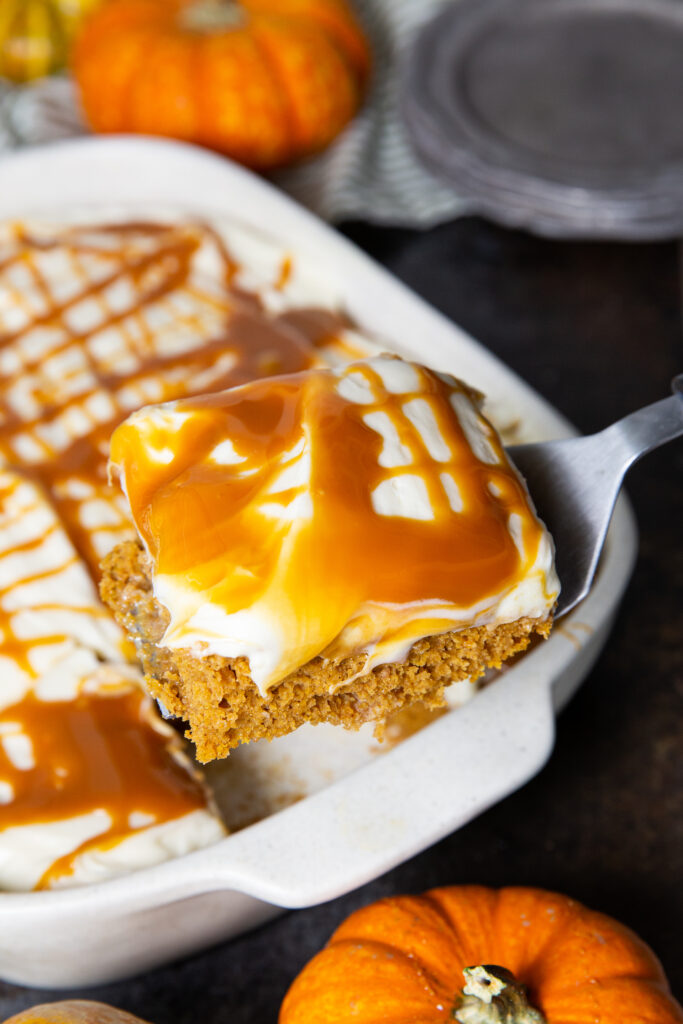 Pumpkin Poke cake, a delicious cake with cream cheese frosting and caramel. 