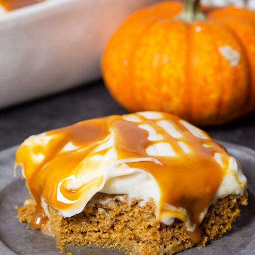 a delicious pumpkin poke cake, loaded with creamy frosting and caramel sauce