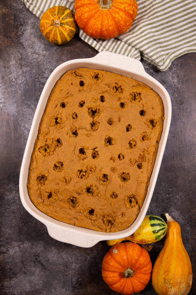 Pumpkin poke cake, poke the holes and loaded with flavor. 