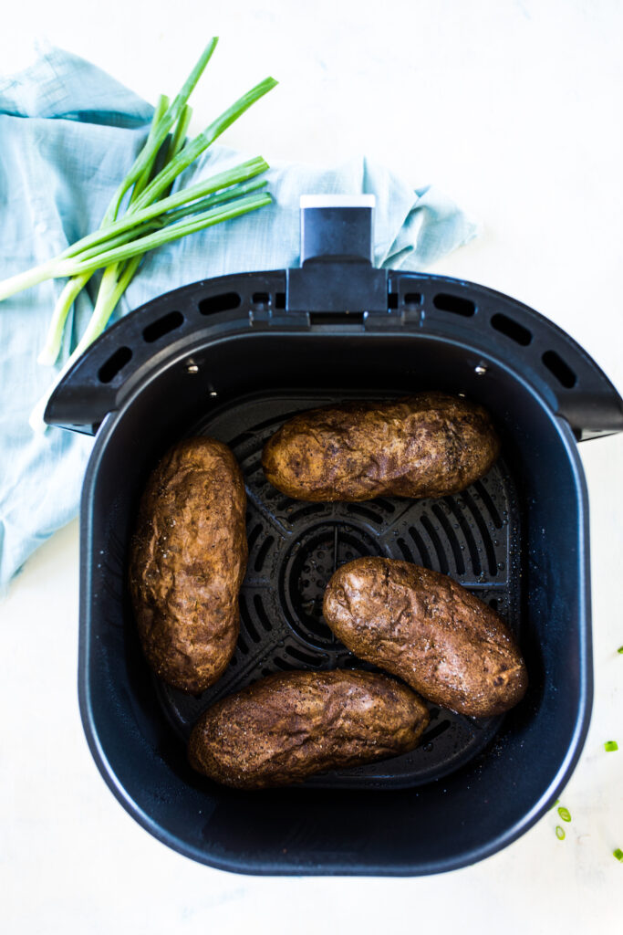 Air fryer baked potatoes are the crispiest skin, fluffiest inside. 