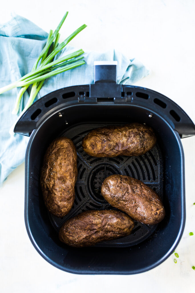 https://www.eazypeazymealz.com/wp-content/uploads/2022/12/Air-Fryer-Baked-Potatoes-1-683x1024.jpg