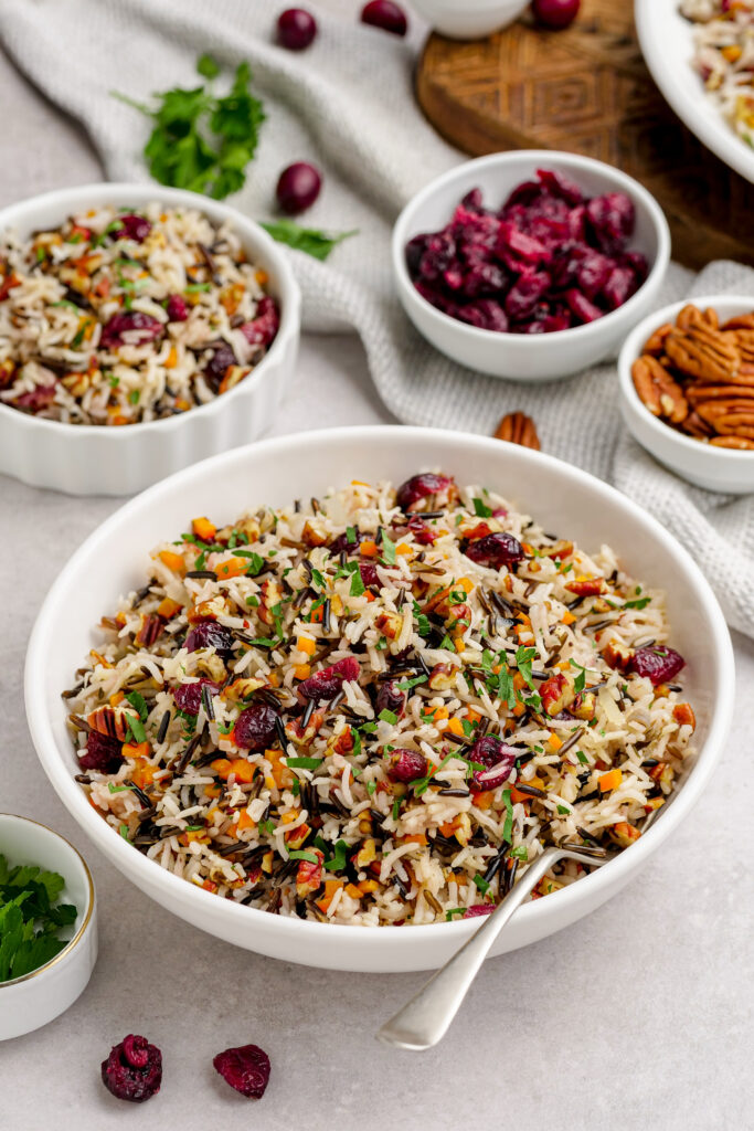 Wild Rice Pilaf in a white bowl, nutty, delicious wild rice pilaf, the perfect side dish. 