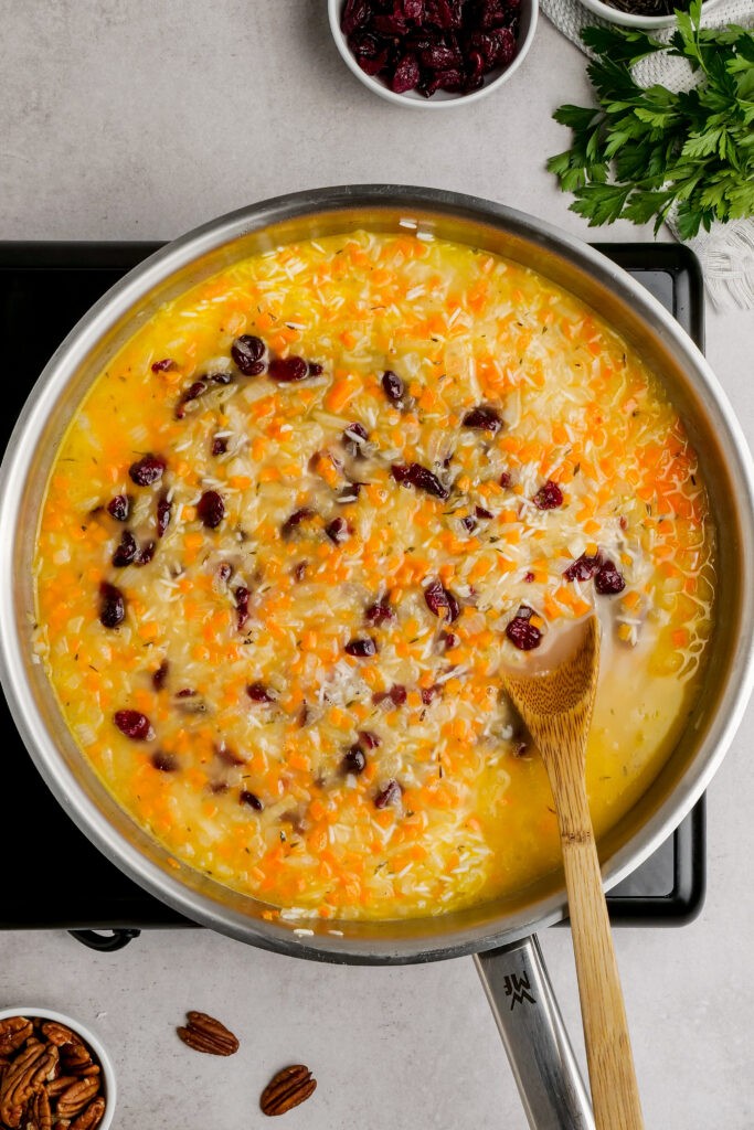 Cooking the white rice and vegetables for a wild rice pilaf