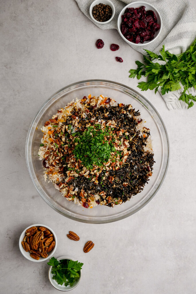 Adding everything together to make wild rice pilaf