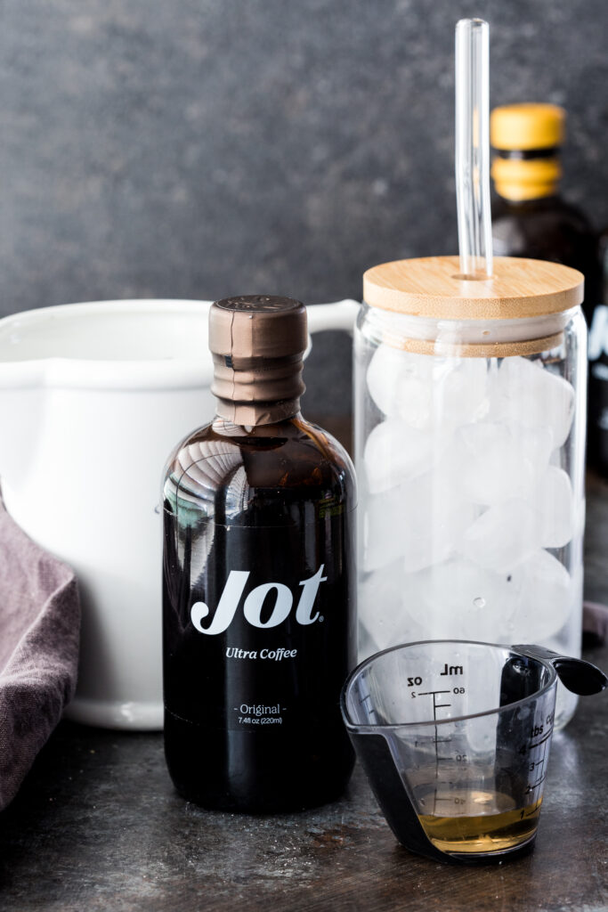 The three ingredients you need for an iced vanilla oat milk latte made with Jot. 