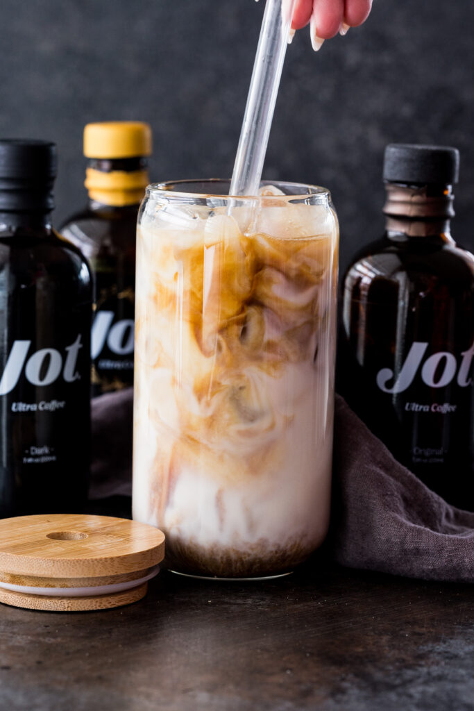 Stir together your iced vanilla oat latte