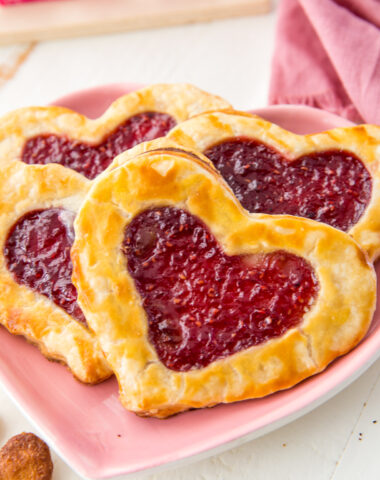 Pop hearts, homemade pop tarts, flakey pie crust stuffed with raspberry jam and baked to golden perfection.