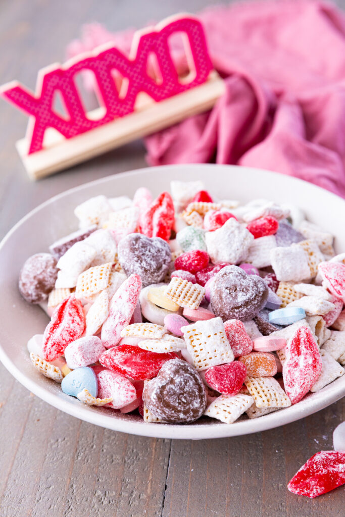 A bowl full of the BEST Valentine Snack Mix, made with Chex cereal and featuring sweet and salty, crunchy and chewy. It has it all and is SO EASY to make!