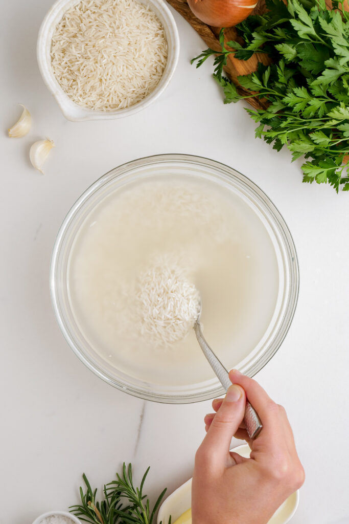 Herbed Rice Pilaf: Rinsing the rice for herbed rice pilaf in order to remove excess starch