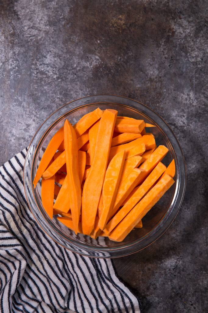 crispy sweet potato fries being prepped for the air fryer