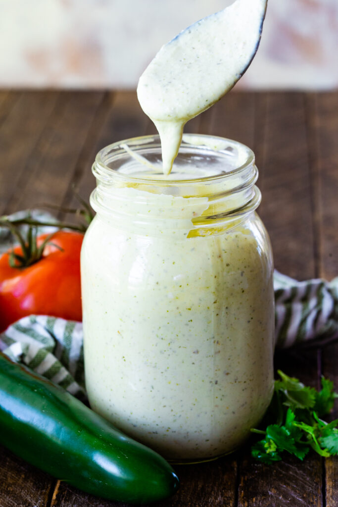 A bottle of tomatillo dressing, a creamy dressing or sauce perfect for Mexican food. 