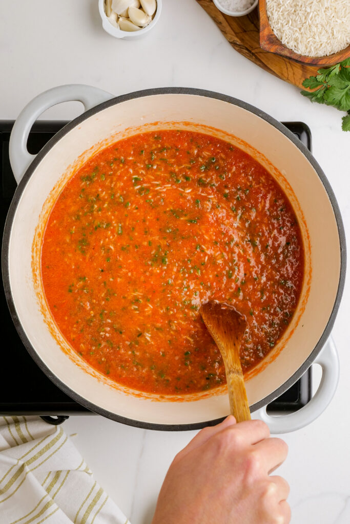 Making your Mexican Rice, adding all the ingredients to get bold flavors