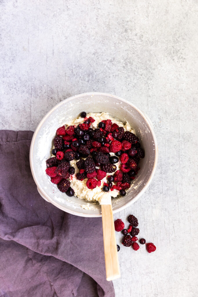 Folding berries into triple berry muffin batter