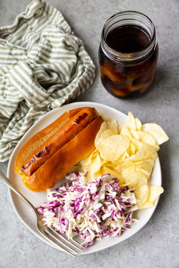 A plate of crunchy, delicious summer coleslaw, with a tangy dressing. 