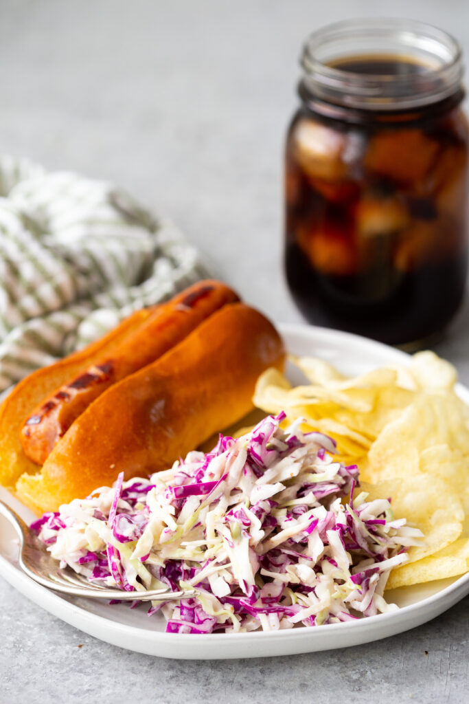 Summer coleslaw that is crunchy, delicious, and tossed in a tangy dressing. 