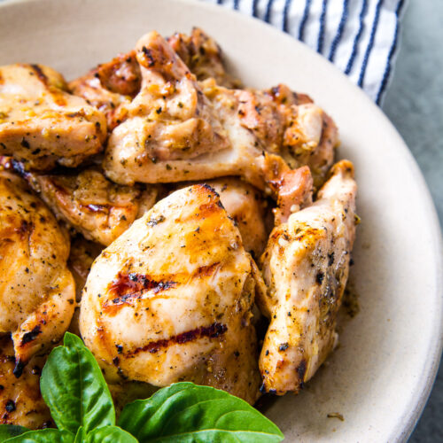 Grilled chicken thighs a tender and juicy chicken thigh with a garlic, lemon, herby marinade.