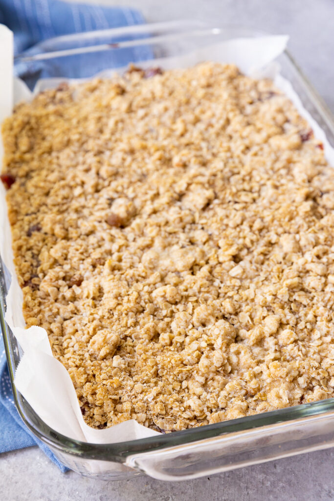 Baking the cherry pie bars with an oatmeal crumble topping.