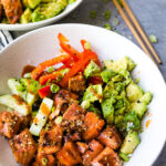Air fryer honey sriracha salmon bites in a rice bowl with pickled vegetables