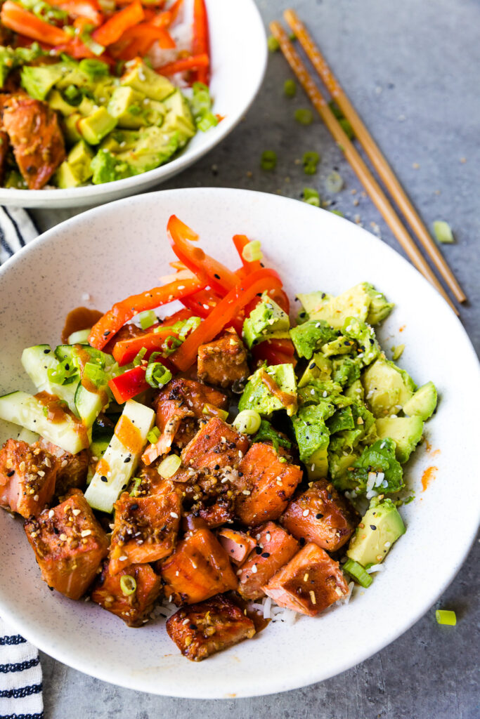 Air fryer honey sriracha salmon bites in a rice bowl with pickled vegetables