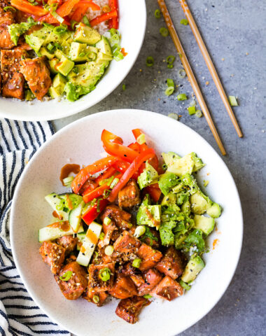 Salmon Rice Bowls with honey sriracha salmon bites, pickled veggies, creamy avocado, green onion and sesame seasoning.