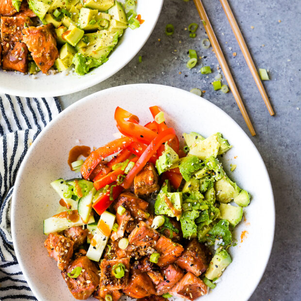 Salmon Rice Bowls with honey sriracha salmon bites, pickled veggies, creamy avocado, green onion and sesame seasoning.