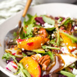 A cozy fall beet salad with mixed greens, goat cheese, two kinds of beets, and toasted pecans.