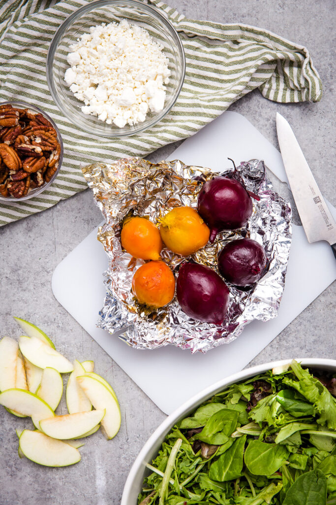 Roasting beets in foil, and then peeling them is the easiest method.