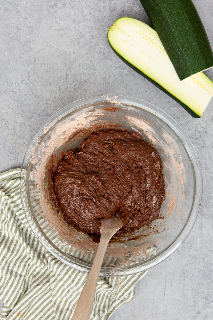 The batter for zucchini muffins with chocolate chunks