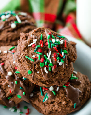 The perfect chocolate christmas cookie, soft and chewy, loaded with chocolate flavor, and topped with drizzled peppermint chocolate and sprinkles.