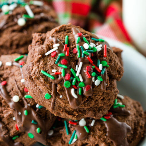 The perfect chocolate christmas cookie, soft and chewy, loaded with chocolate flavor, and topped with drizzled peppermint chocolate and sprinkles.