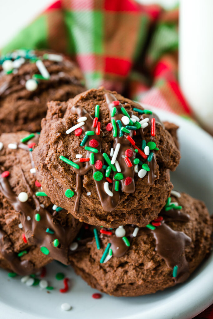 The perfect chocolate christmas cookie, soft and chewy, loaded with chocolate flavor, and topped with drizzled peppermint chocolate and sprinkles. 