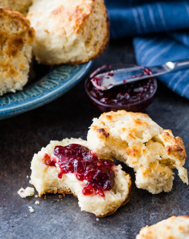 Flaky buttermilk biscuits cooked in a cast iron pan.