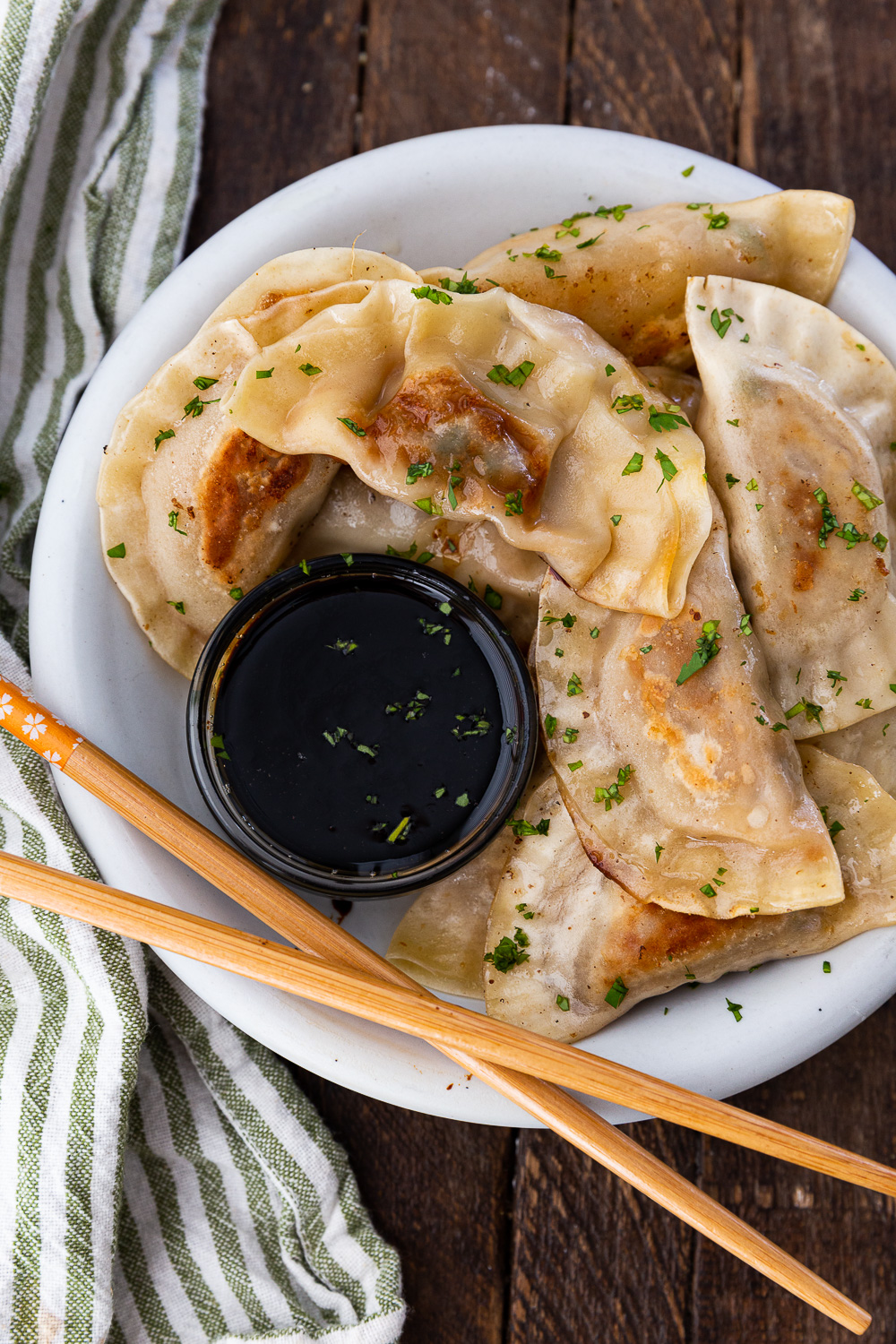 Pan fried pork dumplings with garnish