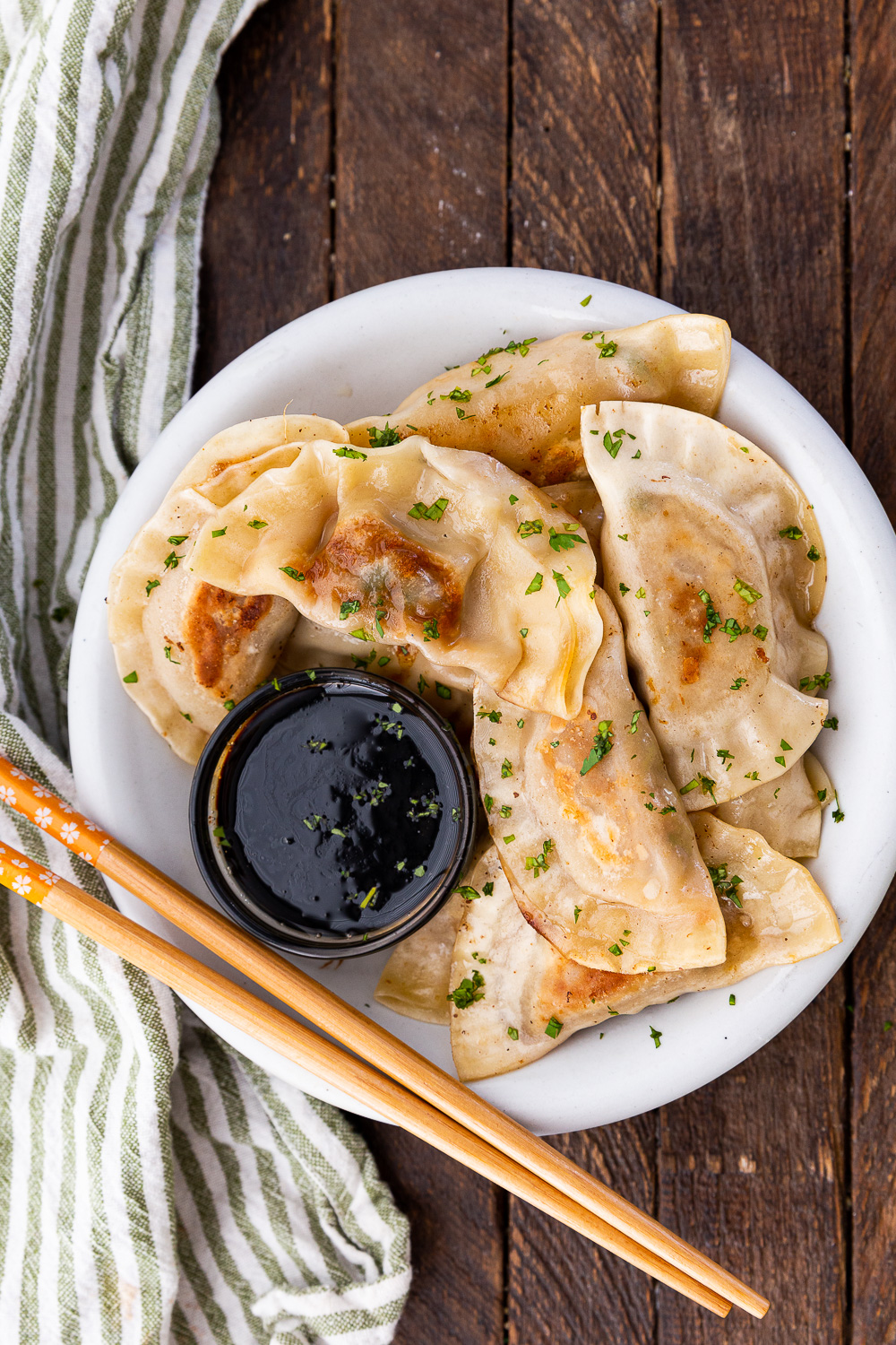 Amazing pork dumplings, pan fried and steamed and loaded with a tasty pork and cabbage filling. 
