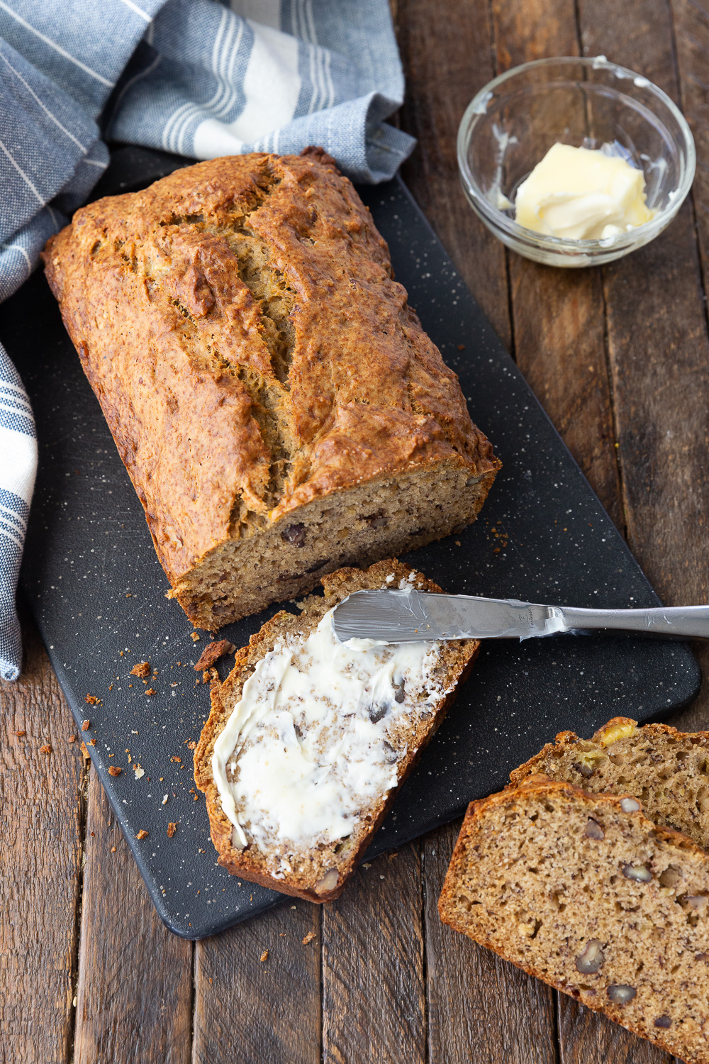 Butter on a slice of browned butter banana bread