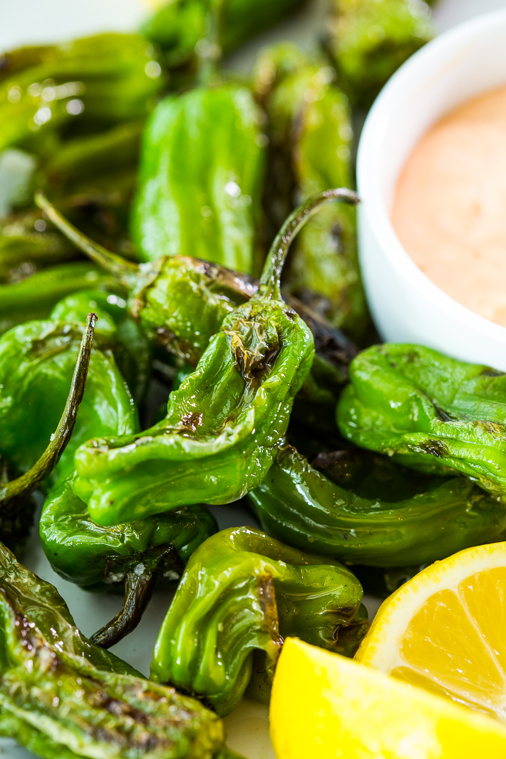 Simple blistered shishito peppers with spicy mayo dipping sauce 