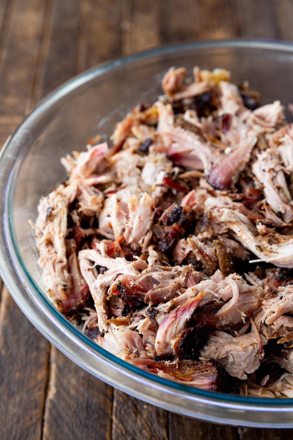 Cajun style pulled pork, cooked on a pellet smoker, and shredded. Butter soft and delicious. 