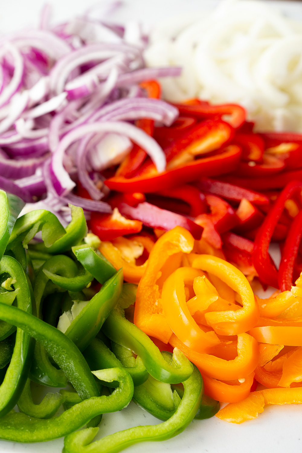 Sliced up onions and peppers for chicken fajitas. 