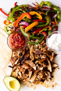 Easy Chicken Fajitas- A super simple recipe for classic chicken fajitas cooked stove top or on the grill or griddle.