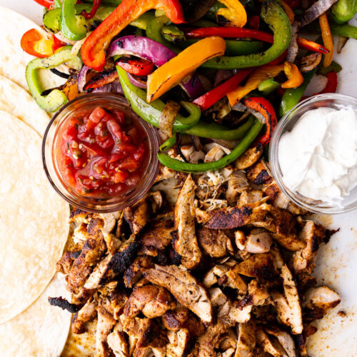 Easy Chicken Fajitas- A super simple recipe for classic chicken fajitas cooked stove top or on the grill or griddle.