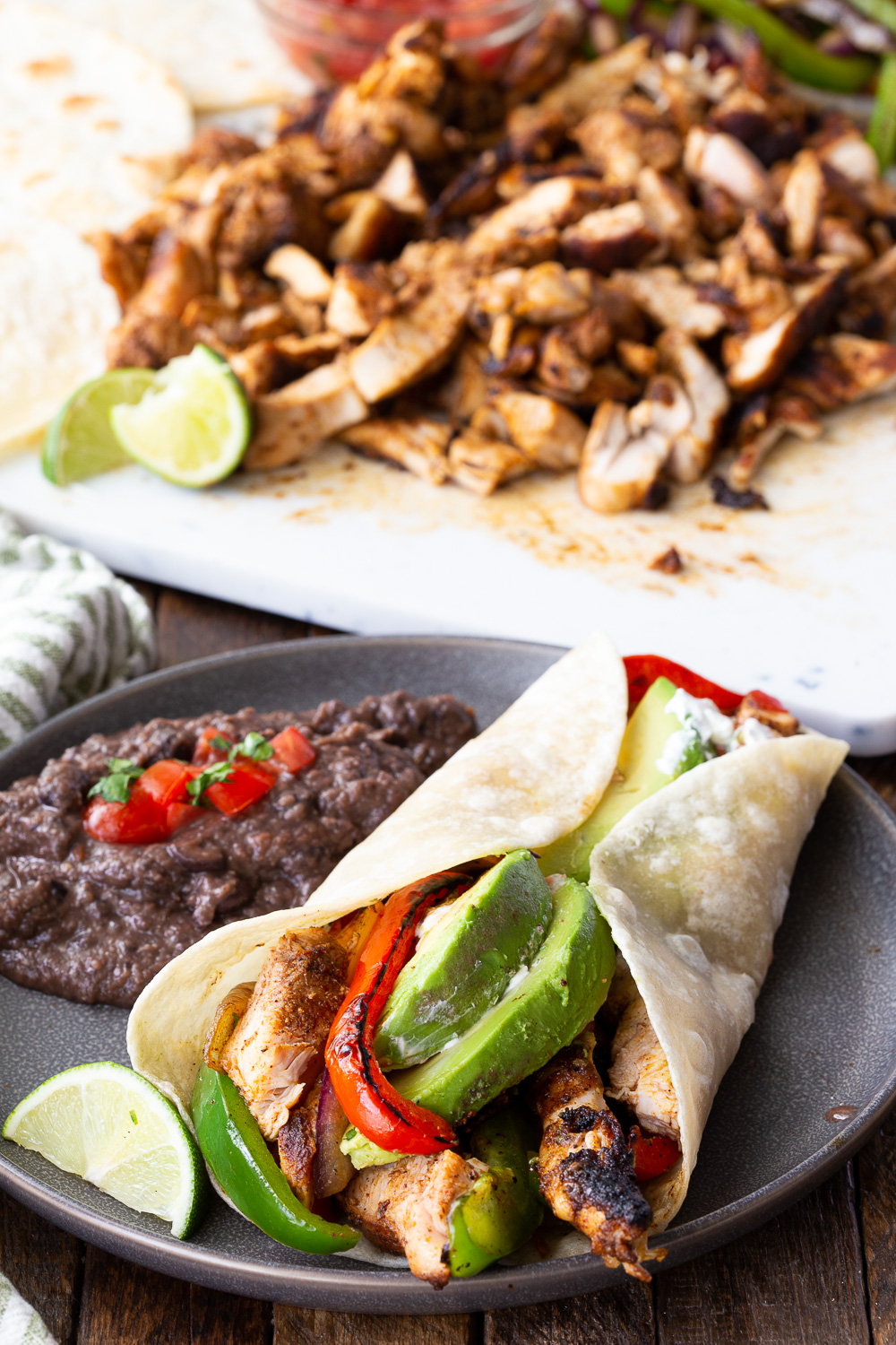 Chicken fajitas served with black beans