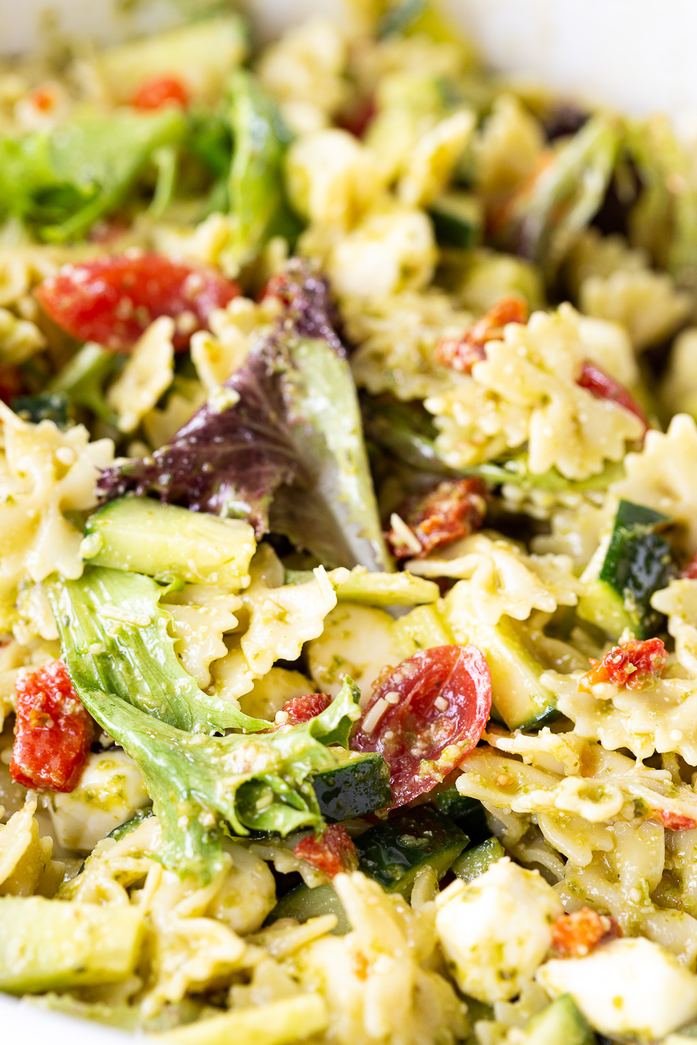 Pesto pasta salad loaded with delicious ingredients that is super easy to make. 