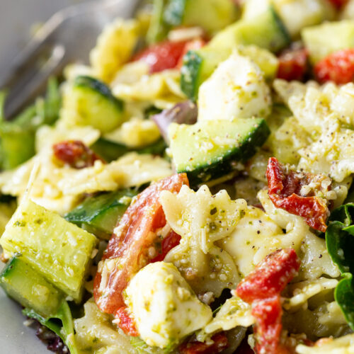 Pesto pasta salad, made with 9 ingredients, and perfect for summer potlucks.